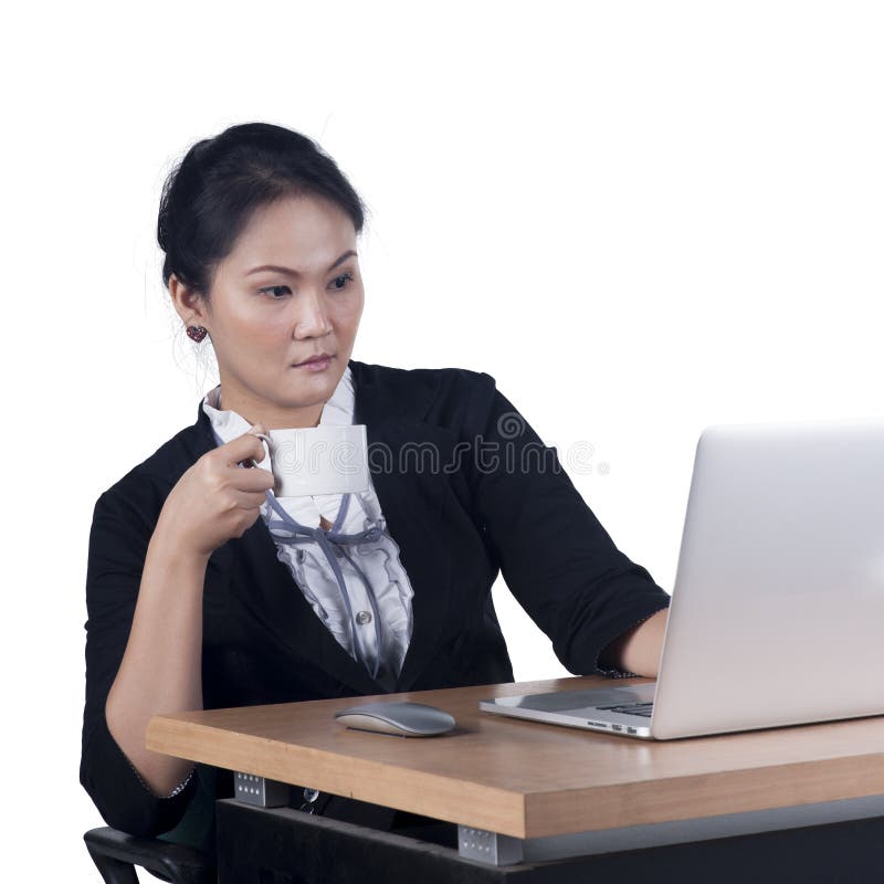 Confident business woman sitting at desk stock photo (135604