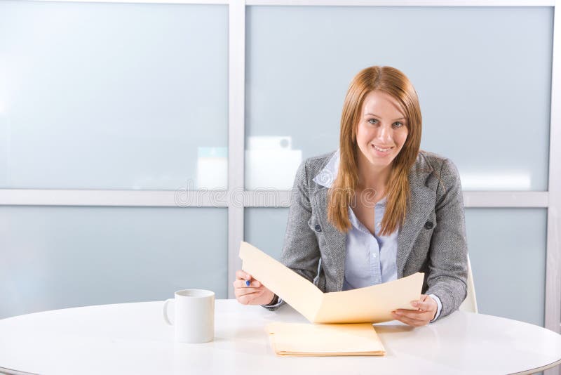 Business woman holding legal documents