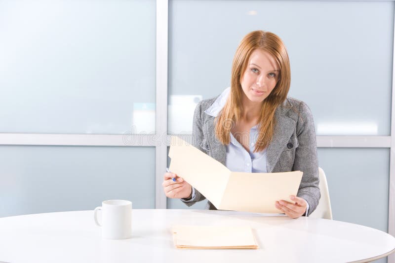 Business woman holding legal documents