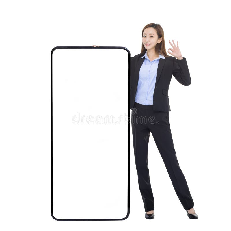 Business woman leaning on huge cellphone with blank white screen, showing ok gesture, recommending great new app or website for sm