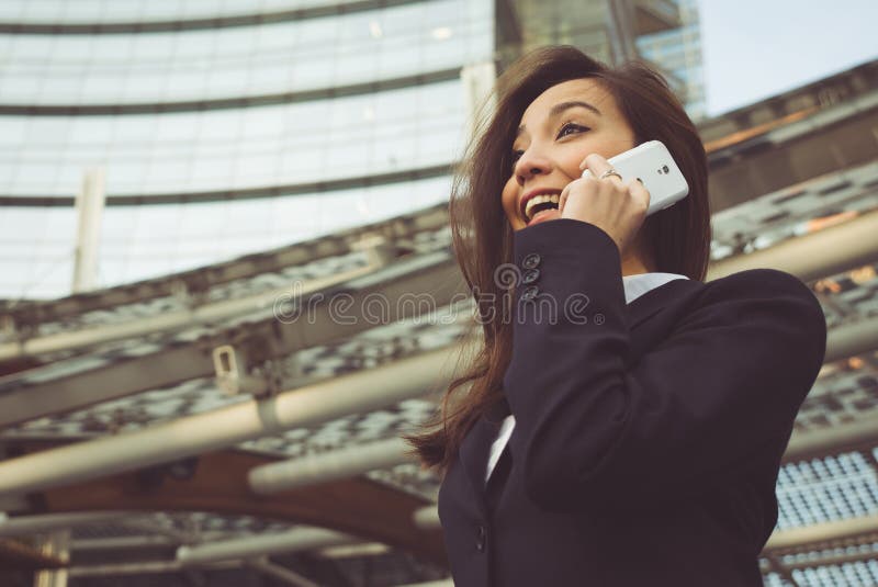 Business woman making a phone call outside the office. concept about business people and professions