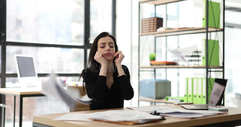 Business woman in office is serious about work stressed and worried about not completing tasks on time stock footage