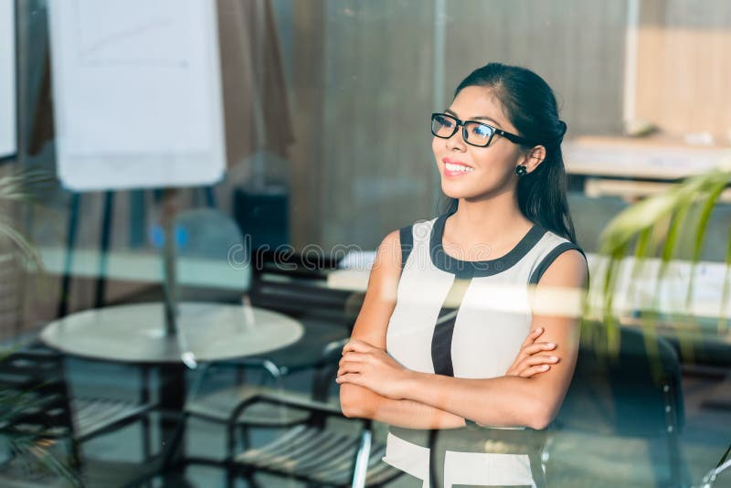 Business woman at office window stock images Business woman at office window stock images