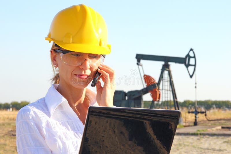 Business woman in an oilfield stock photos Business woman in an oilfield stock photos