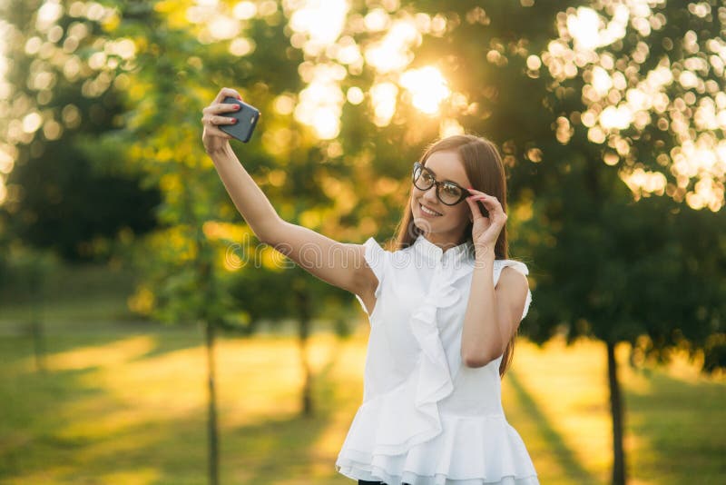 Business woman in the park using phone royalty free stock photos Business woman in the park using phone royalty free stock photos
