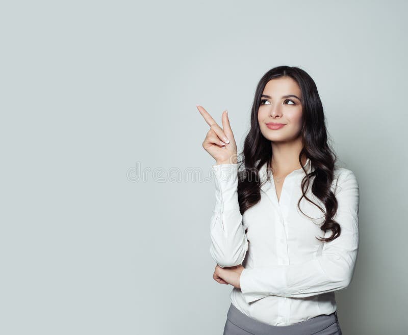 Business woman pointing her finger up