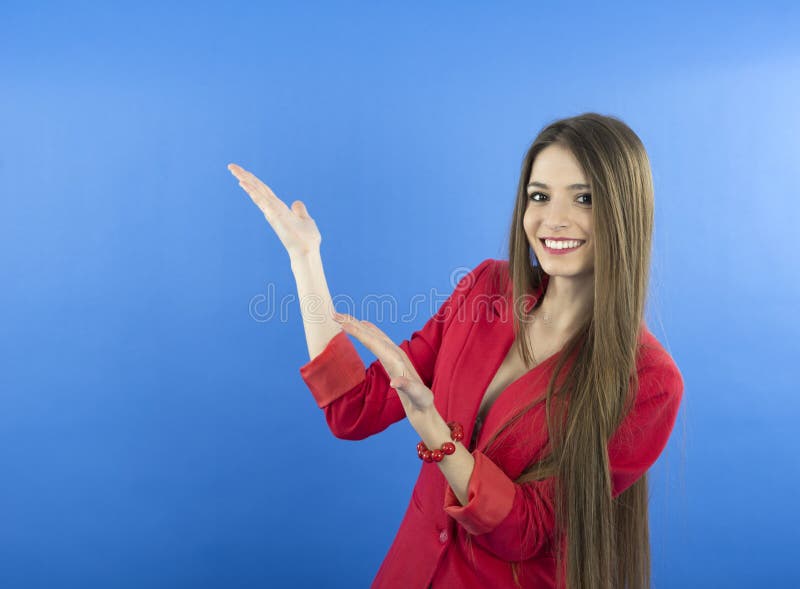 Business woman presenting. Isolated over blue background royalty free stock image