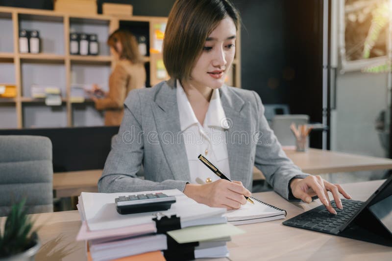 Business Woman Sitting On Desk Using Laptop Portrait Of Busy Secretary