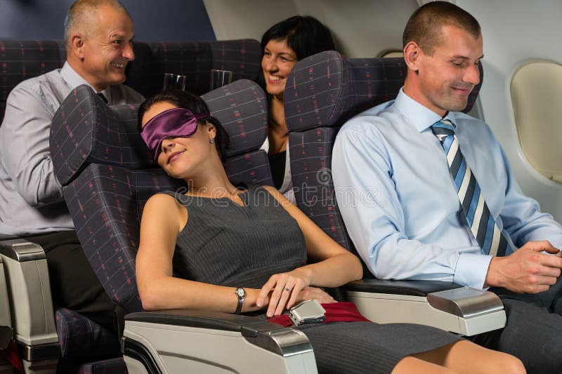 Business woman sleep during flight airplane cabin