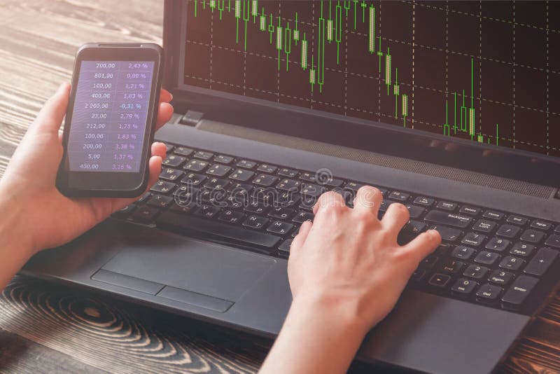 Business woman with smart phone show financial market chart, laptop show financial market chart, Stock market concept. royalty free stock photography Business woman with smart phone show financial market chart, laptop show financial market chart, Stock market concept. royalty free stock photography