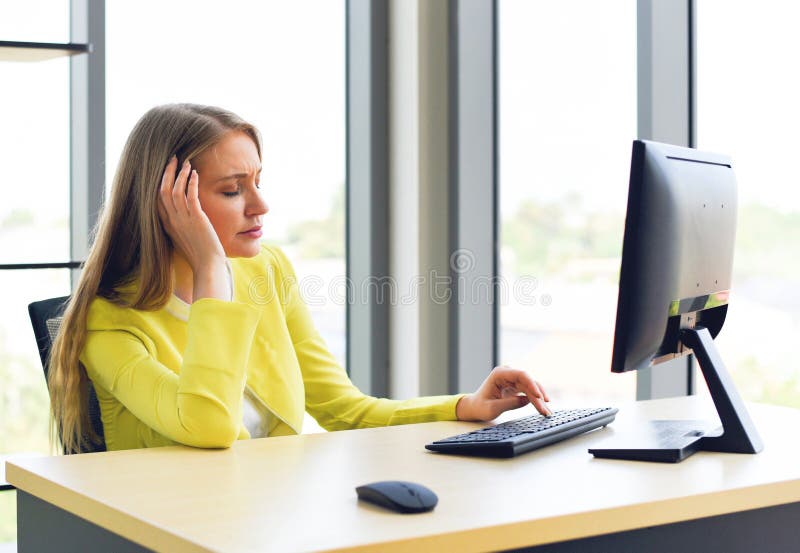 Business woman suffering stress working computer on the desk - Stressed woman tired with headache at office feeling sick at work