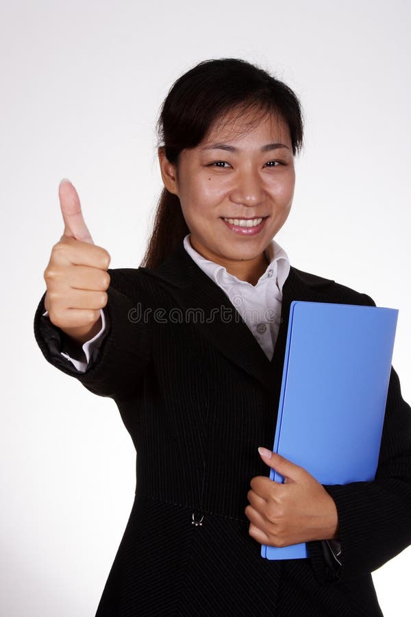 Business woman with thumbs up