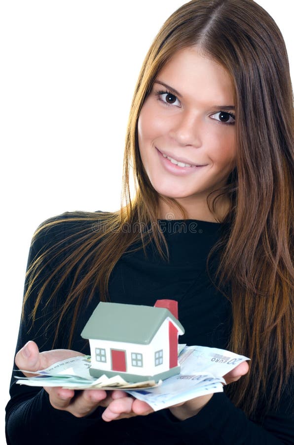 Business woman with the toy house and banknotes