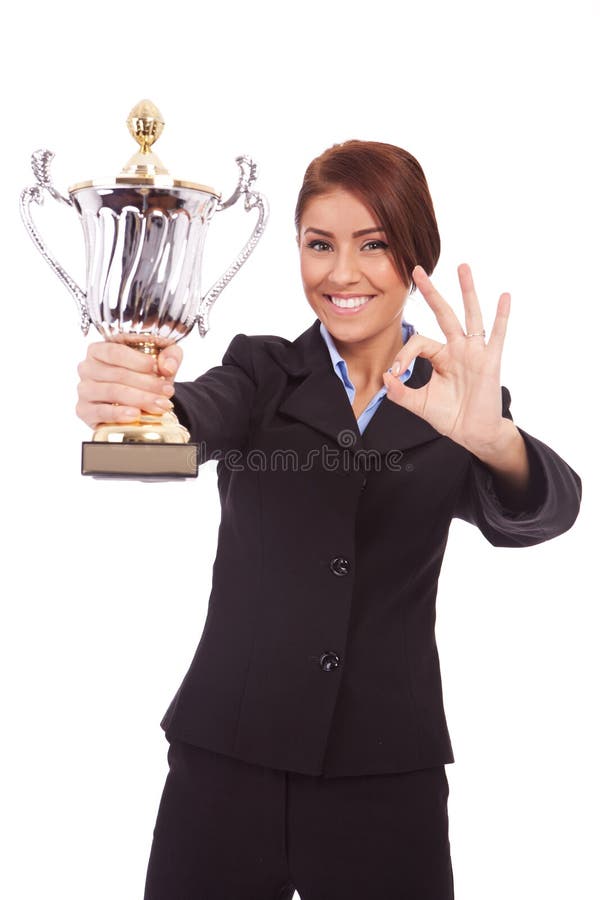 Business woman with trophy make ok gesture