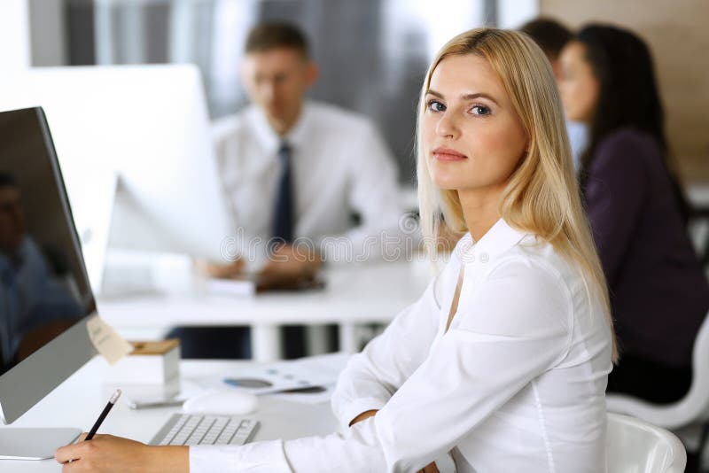 Business Woman Using Computer At Workplace In Modern Office Secretary