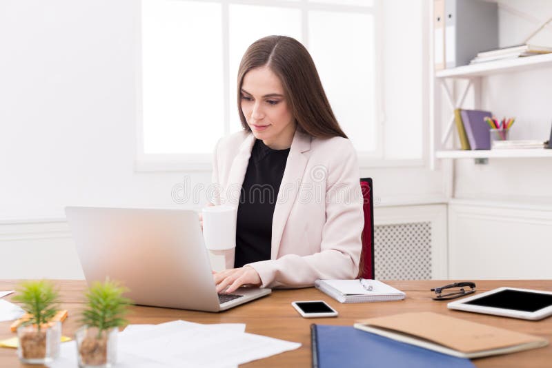 Business woman working on laptop at office royalty free stock image Business woman working on laptop at office royalty free stock image