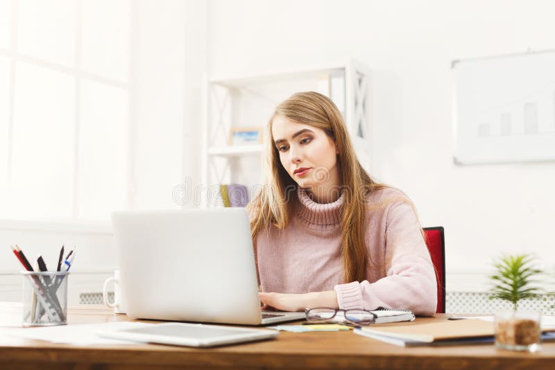 Business woman working on laptop at office royalty free stock image Business woman working on laptop at office royalty free stock image