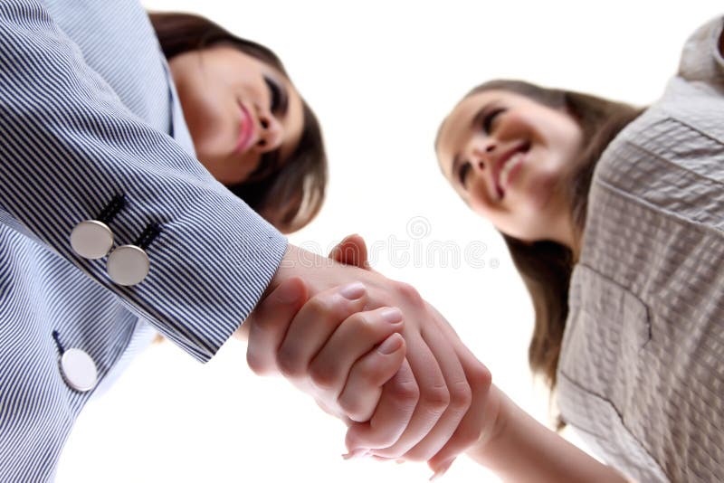 Business women shaking hands