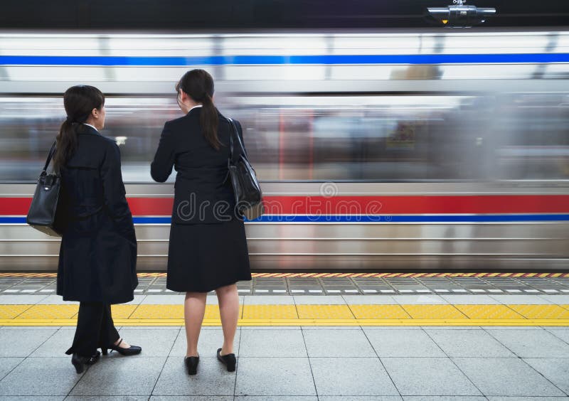 Business women waiting subway train Japan transportation city lifestyle