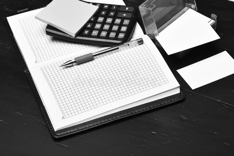 Business and work concept: calculator, notebook and business card holder stock photography