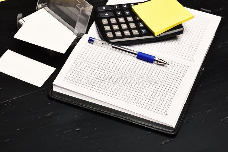 Business and work concept: calculator, notebook and business card holder royalty free stock photos
