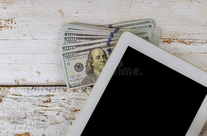 The workplace of business a tablet and US dollars money
