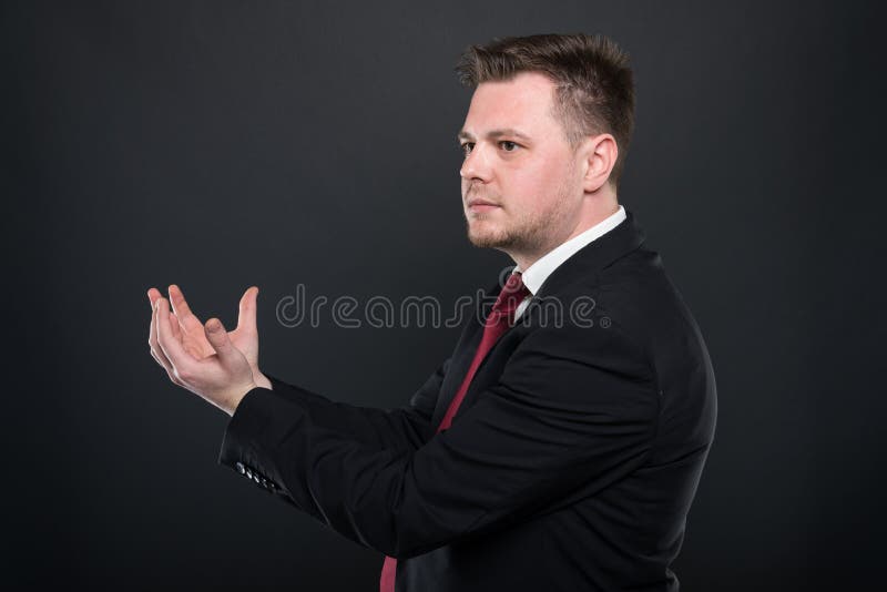 Business young man holding something in both hands royalty free stock images