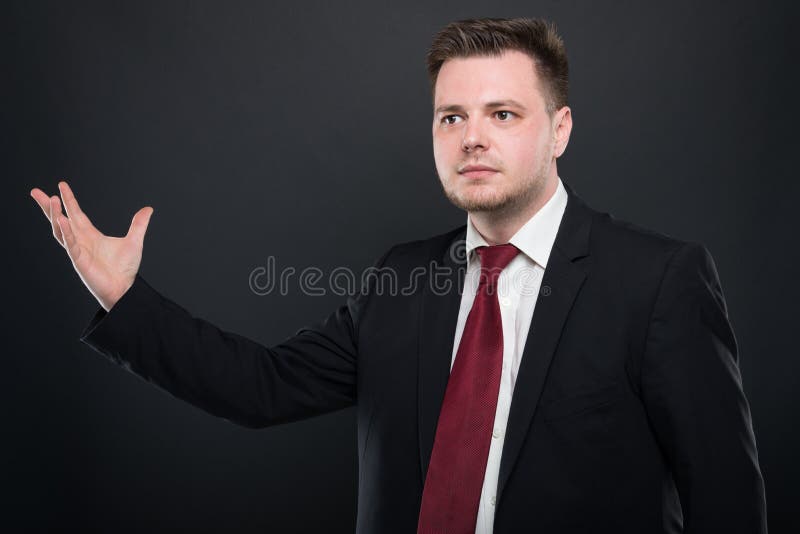 Business young man holding something in one hand stock images