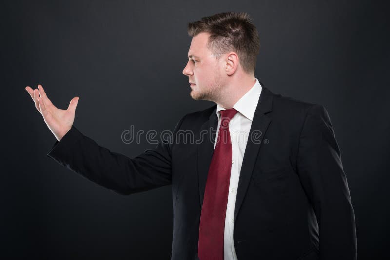 Business young man holding something in one hand stock photo