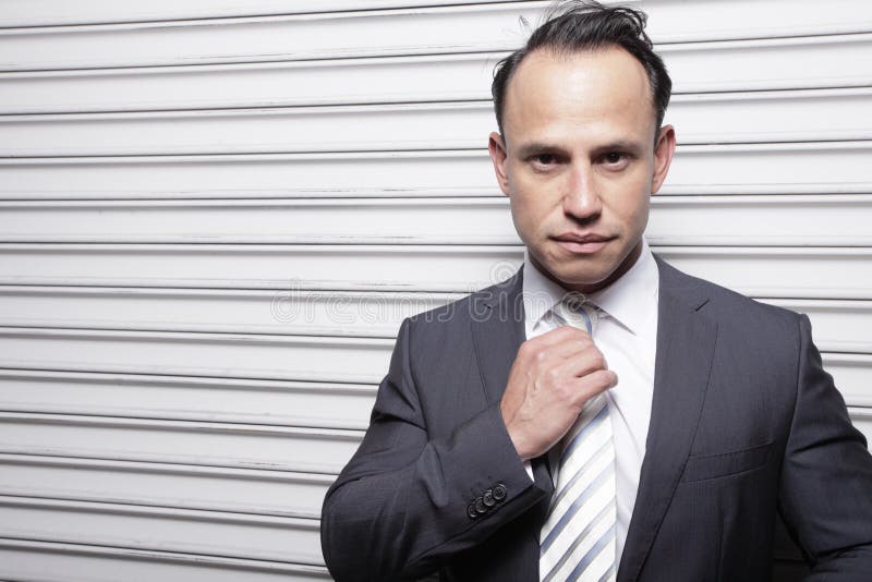 Businessman adjusting his tie royalty free stock images Businessman adjusting his tie royalty free stock images