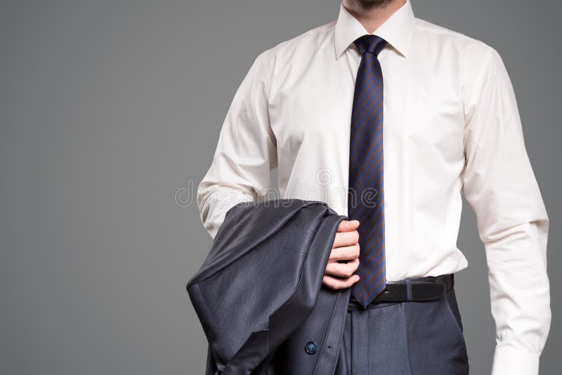 Businessman against gray background. Copyspace for text. royalty free stock image