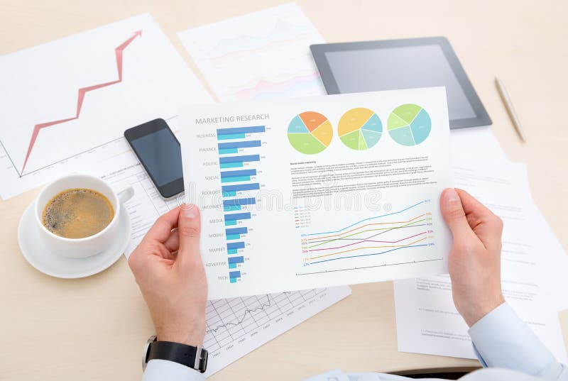 Businessman at the modern workplace analyzing success information on the chart. Diagram marketing research concept stock images, royalty-free photos and pictures