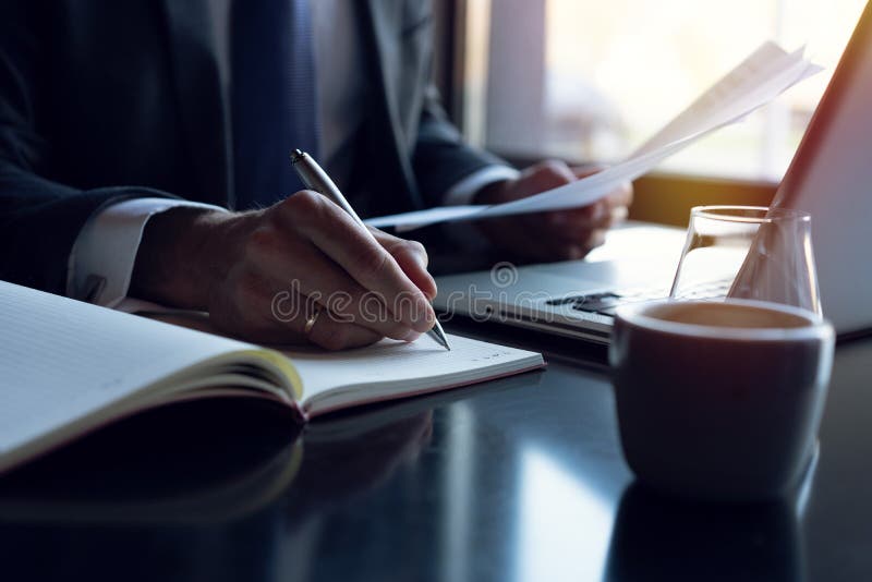 Businessman analyzing investment charts. Accounting. Hands of financial manager taking notes while working. royalty free stock photo Businessman analyzing investment charts. Accounting. Hands of financial manager taking notes while working. royalty free stock photo