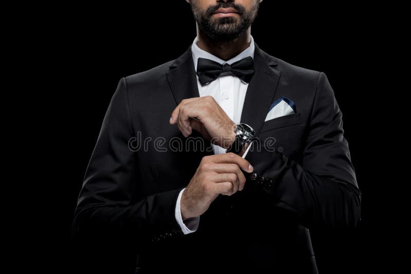 Businessman in Bow Tie and Tuxedo with Watch, Isolated on Black Stock ...