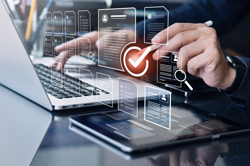 Businessman check marks,checkboxes with electronic survey form or digital document file. organizations and human resource royalty free stock photo