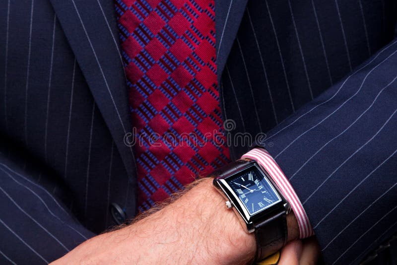 Businessman checking the time on his watch royalty free stock images Businessman checking the time on his watch royalty free stock images