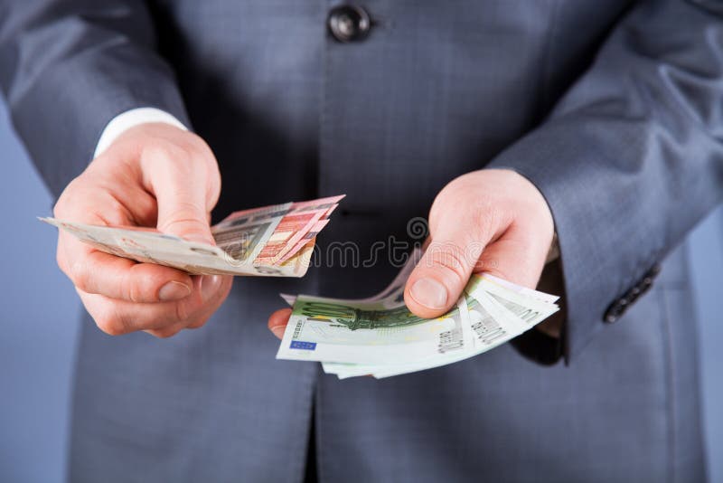 Businessman counting euro money