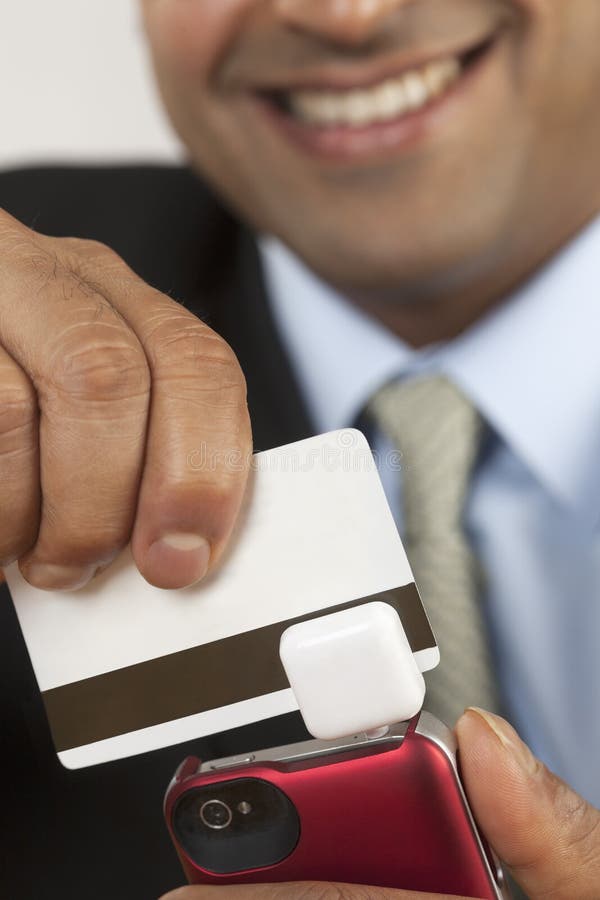 Businessman with credit card swiper royalty free stock images Businessman with credit card swiper royalty free stock images