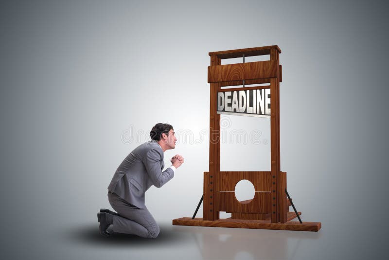 Businessman in deadline concept with guillotine royalty free stock photo Businessman in deadline concept with guillotine royalty free stock photo