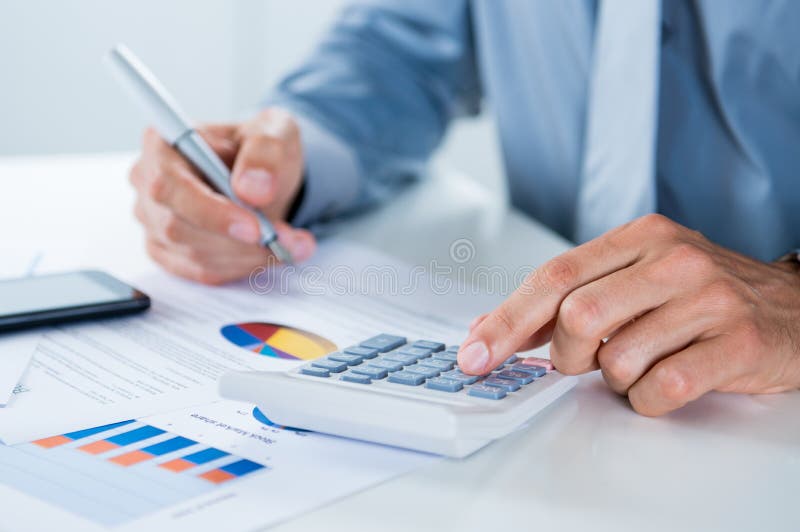 Businessman Doing Calculations stock photography