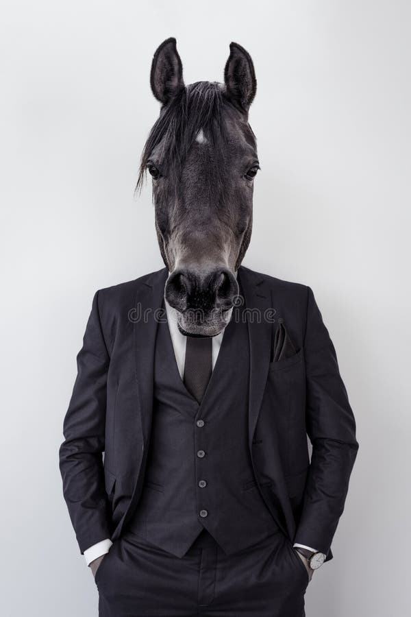 Businessman Dressed in a Suit with a Horse Head. Concept of a Working
