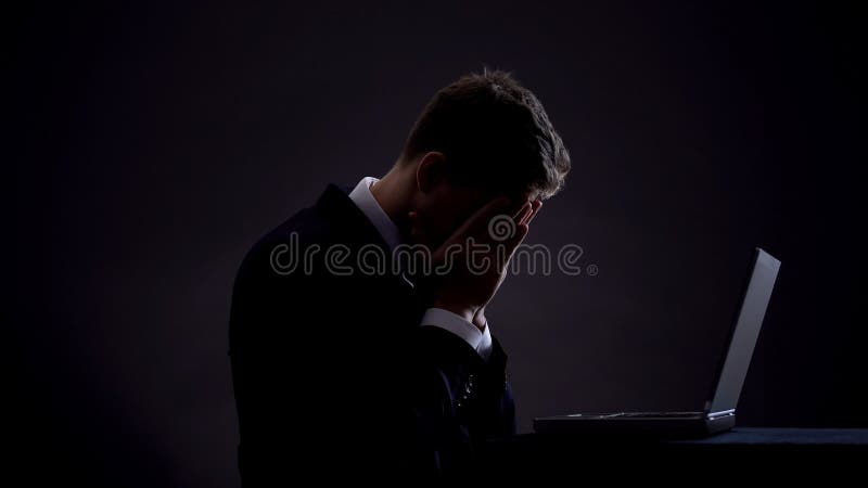 Businessman feeling disappointed, sitting front laptop, no funding for start up royalty free stock photos Businessman feeling disappointed, sitting front laptop, no funding for start up royalty free stock photos
