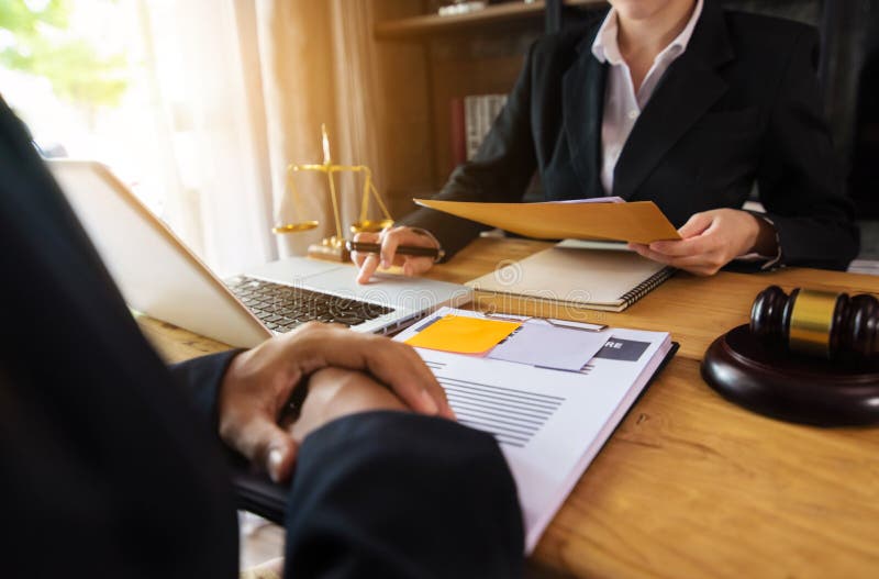 Businessman and female lawyer or judge consult having team meeting with client. royalty free stock photography Businessman and female lawyer or judge consult having team meeting with client. royalty free stock photography