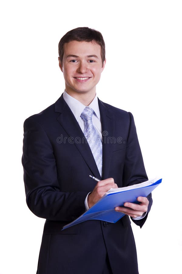 Businessman smiling holding folders. Happy young business man with documents ready to seal a deal. Businessman smiling holding folders. Happy young business man with documents ready to seal a deal.