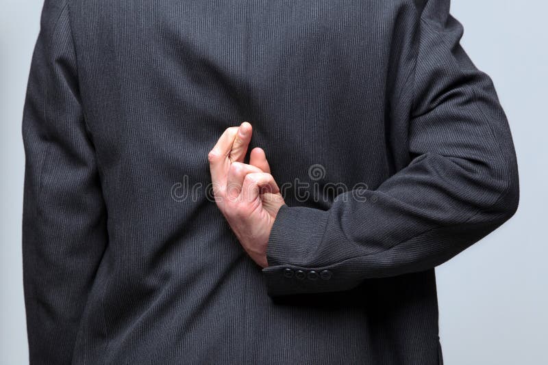 Businessman fingers crossed behind his back royalty free stock images Businessman fingers crossed behind his back royalty free stock images