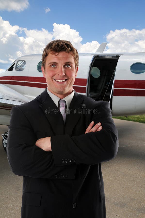 Businessman In Front of Airplane stock images