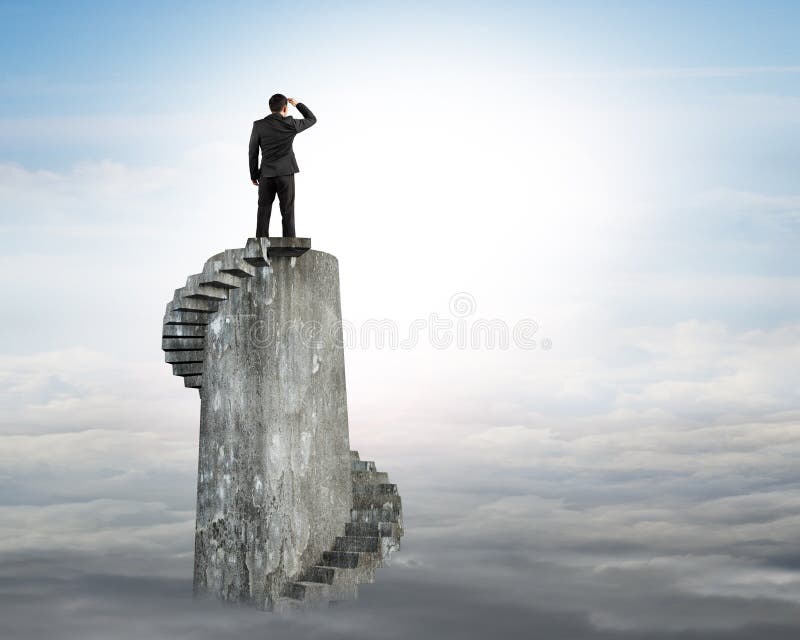 Businessman gazing on top of spiral tower