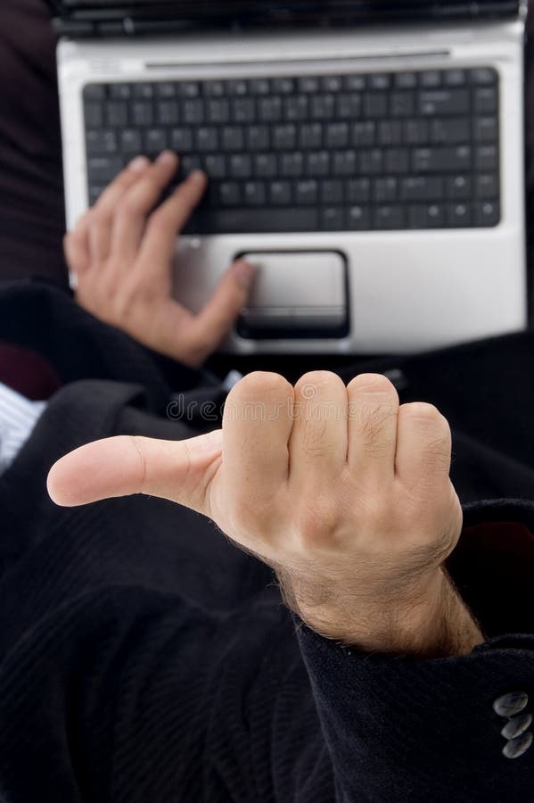 Businessman gesturing thumbs up