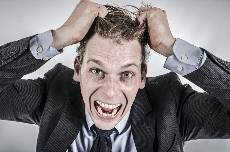 businessman-going-crazy-pulling-his-hair