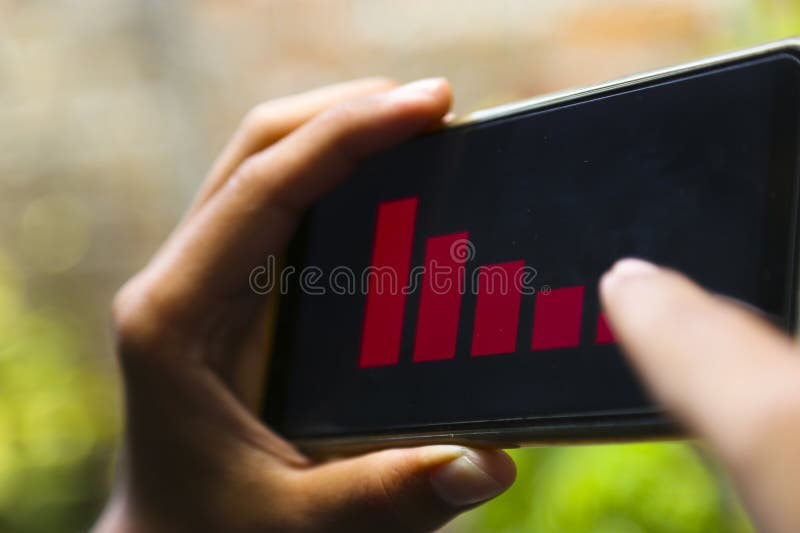 Businessman han showing decrease graph on smartphone. Use for layout design background. Decrease image stock images, royalty-free photos and pictures